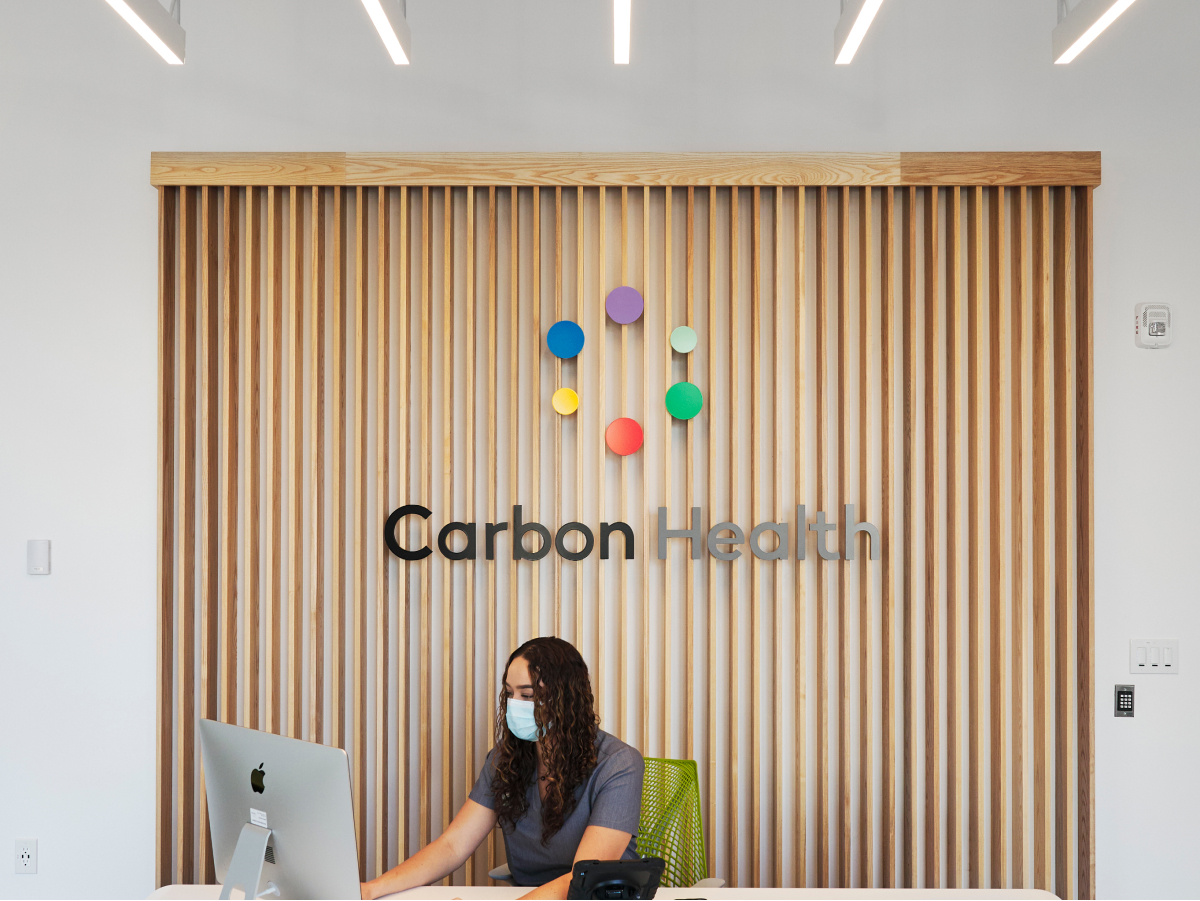 A well-lit, modern front desk area in one of our Carbon Health locations.