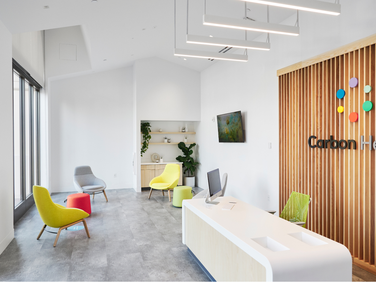A bright, naturally lit entry and waiting room in one of our Carbon Health locations.