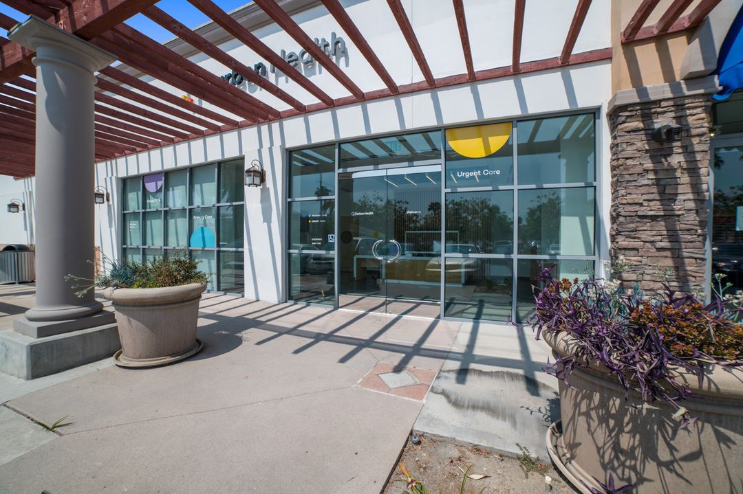 The brightly lit entryway to a waiting room with a sleek, modern design